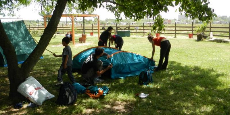 Campamento, cañuelas, acampar, escuelas, camping, educativo, grupo de chicos, salida educativa, exclusivo, fin de semana, pocos km, ezeiza, iniciarse al campamento, base, acampada, camping, acampar, cerca, capital, pocos km, lobos, cañuelas, san miguel del monte, uribelarrea, udaondo abott, campo, fogon, rustico, scouts, alquiler carpas, bolsa de dormir, linternas, parque4x4, smata, maximo paz, vicente casares, ezeiza, horno de barro, familia, chicos chicos, pequeños, primera experiencia, naturaleza, verde, salir, arboleda, quincho cerrado, seguridad, iluminación, fogón, parrilla, deportes aventura, quincho, juegos para chicos, juegos trepadores, casa en el árbol, escaladores, campestre, atardecer, la tranquera, general rodriguez, escuela de gimnasia, profesores, sevicios, viaje educativo, bosque, experiencia educativa, pileta, piscina, tobogan inflable, pelotero, mancha, deportes, cancha, futbol, voley, paseo nocturno, en caso de lluvia, transporte escolar, micro de alquiler, maestros de escuela, colegios, educación privada, viaje fin de curso, experiencia campamentil, colonia escolar, educación en el medio natural, Aula, Naturaleza, actividades físicas en el medio natural, educación Física, educación primaria, actividades físicas en la naturaleza, pre-campamento, colonia de vacaciones, vida en la naturaleza, tavien, prácticas en el medio natural; cuidado y preservación del medio ambiente, interpretación natural, campo privado, predio cerrado, integración, sholem, intercolegial, torneo, campo aventua, barrancas, lujan, puente de sogas, caminata nocturna, entorno controlado, construir, refugios, laguna, juego, grupo, charlas, iglesias, retiro espiritual, catequesis, campamentos catolicos, proyecto campamento, arborismo, baradero, dormies, granja, contingente, alojamiento, interpretación, mangrullo, plantas nativas, colonia suiza, programa educativo, san antonio de areco, los robles, campamento recreativo, armado de carpas, capilla del señor, excursiones de colegios, grupo scout.